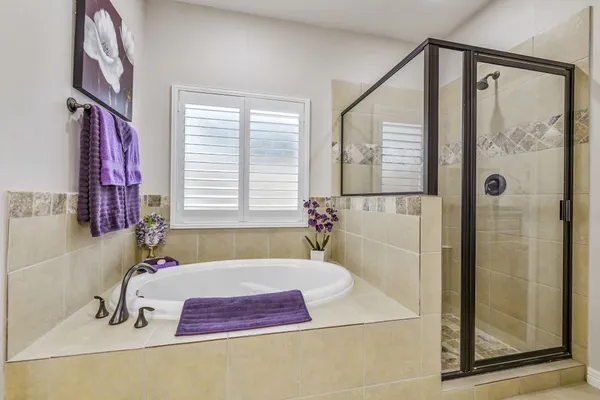 a bath tub sitting next to a bathroom sink