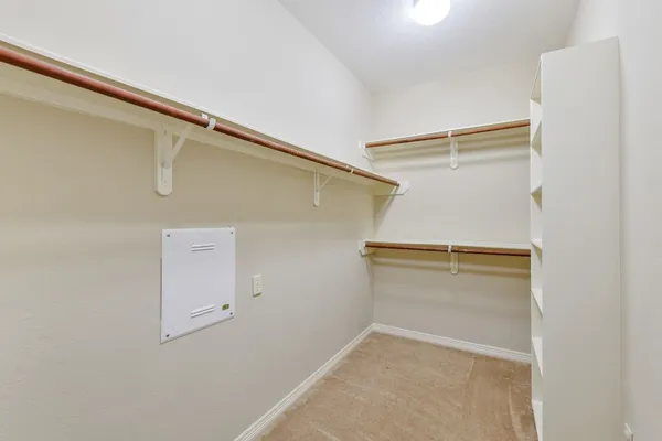 a view of an empty walk in closet