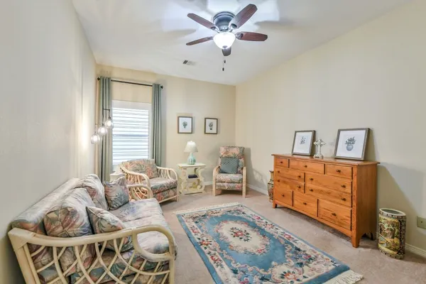 a bedroom with furniture and a window