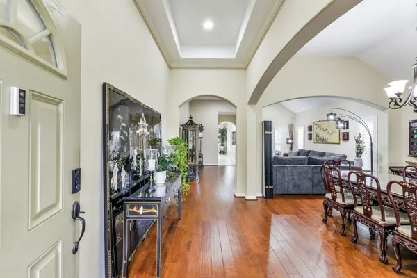 a view of a livingroom with furniture hardwood floor and a living room