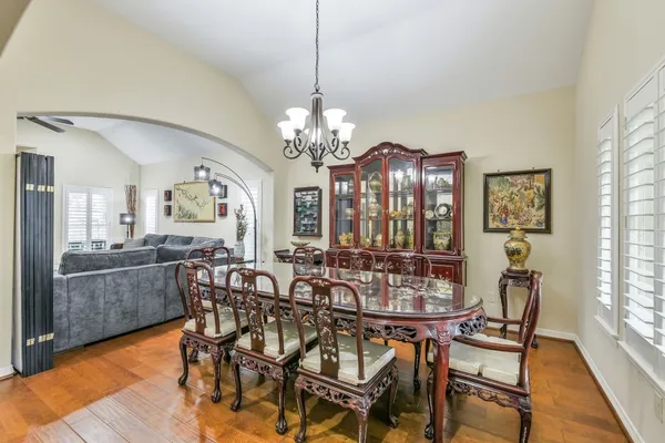 a view of a dining room with furniture and window
