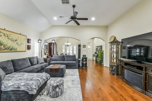 a living room with furniture fireplace and flat screen tv