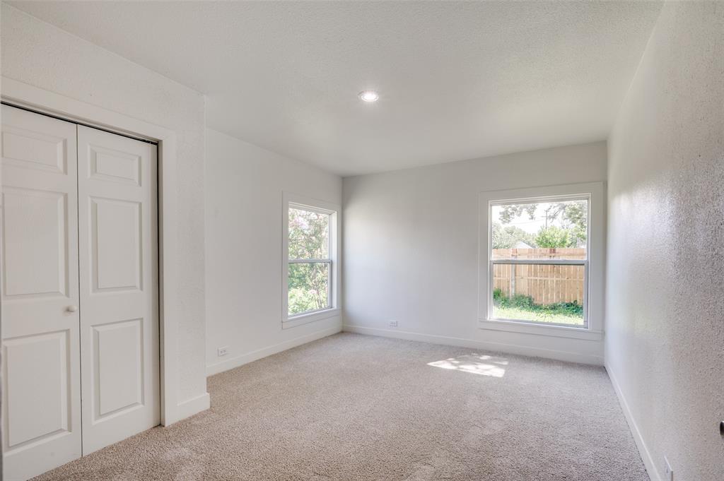 107 McArthur Lane Cleburne, TX 76031 - Photo 13 of 26 an empty room with windows