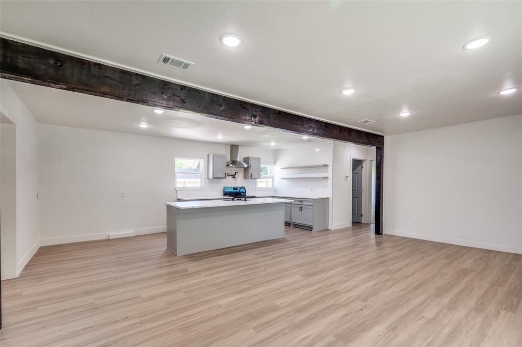 107 McArthur Lane Cleburne, TX 76031 - Photo 7 of 26 a view of a kitchen with wooden floor