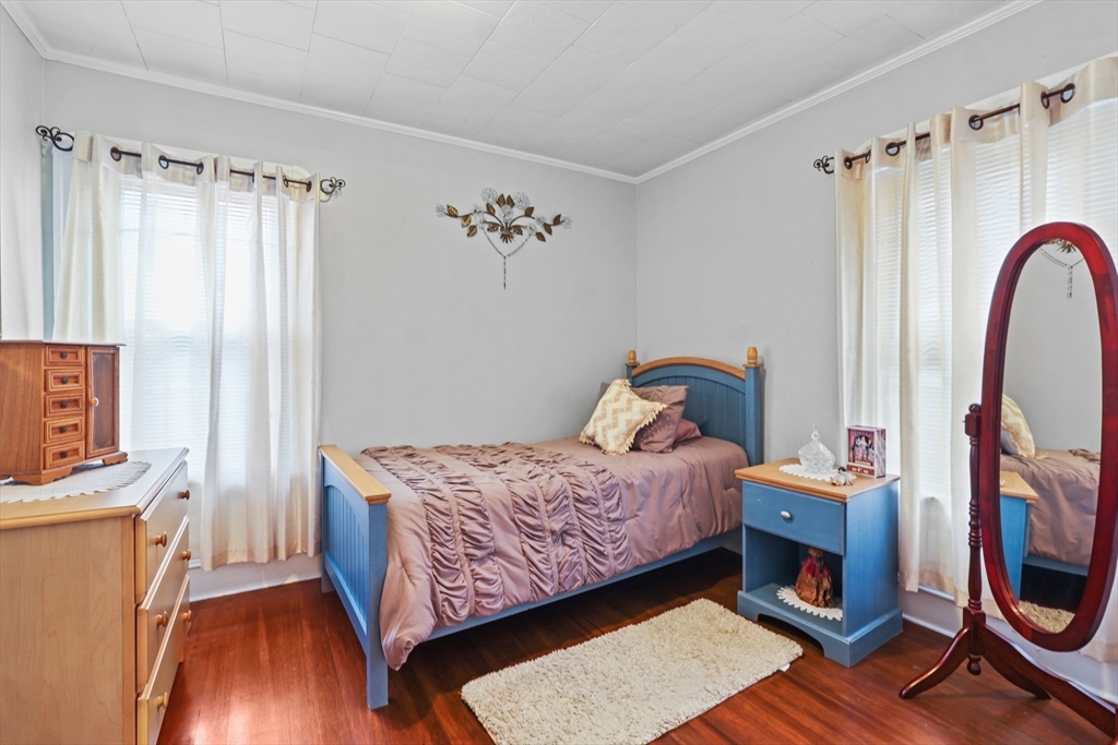 161 Foster Street Fall River, MA 02721 - Photo 13 of 20 a bedroom with a bed and a mirror on the dresser