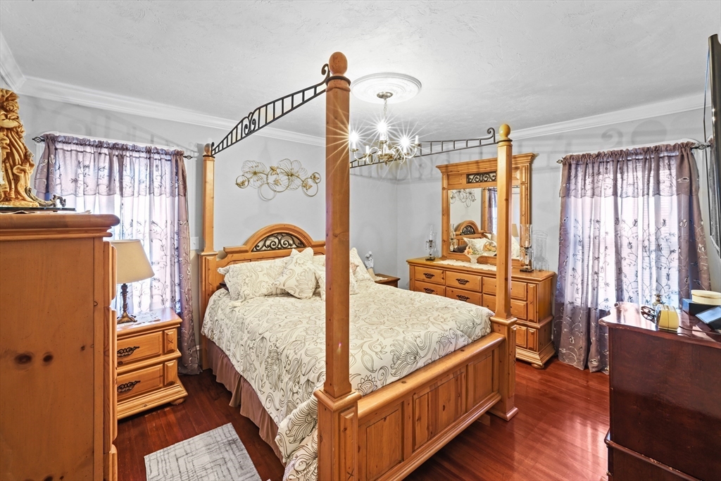 161 Foster Street Fall River, MA 02721 - Photo 15 of 20 a bedroom with a bed and wooden floor