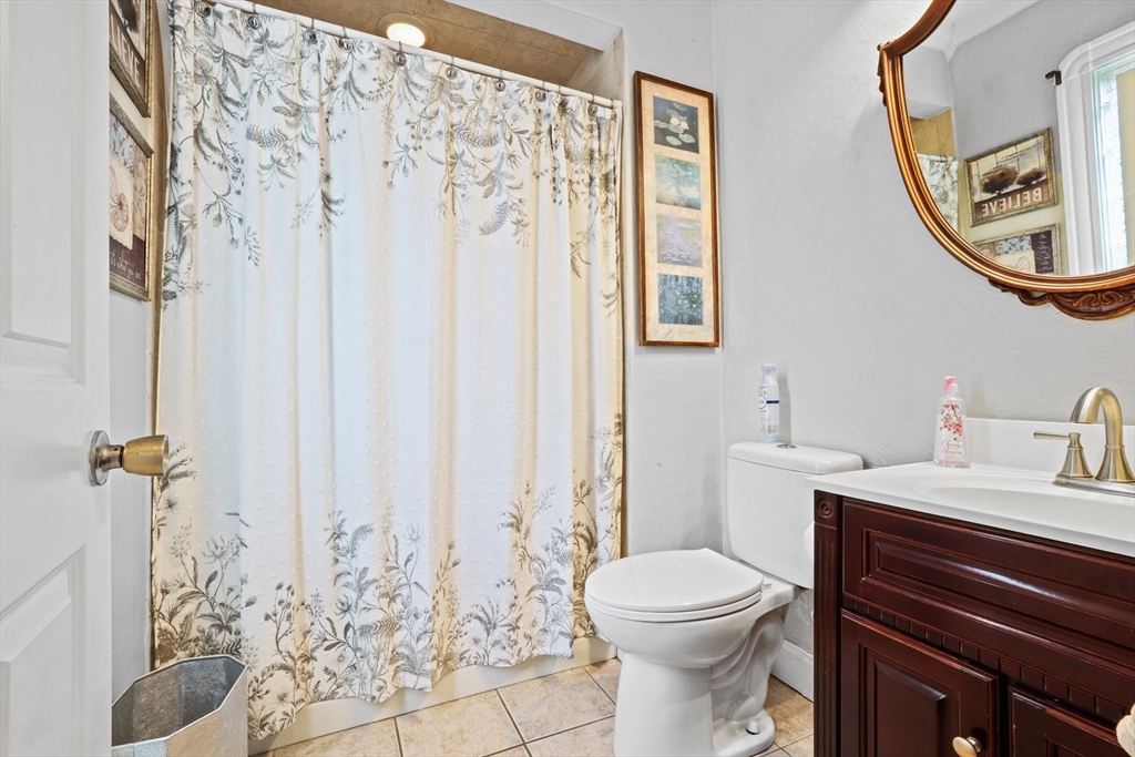 161 Foster Street Fall River, MA 02721 - Photo 16 of 20 a bathroom with a toilet sink and mirror