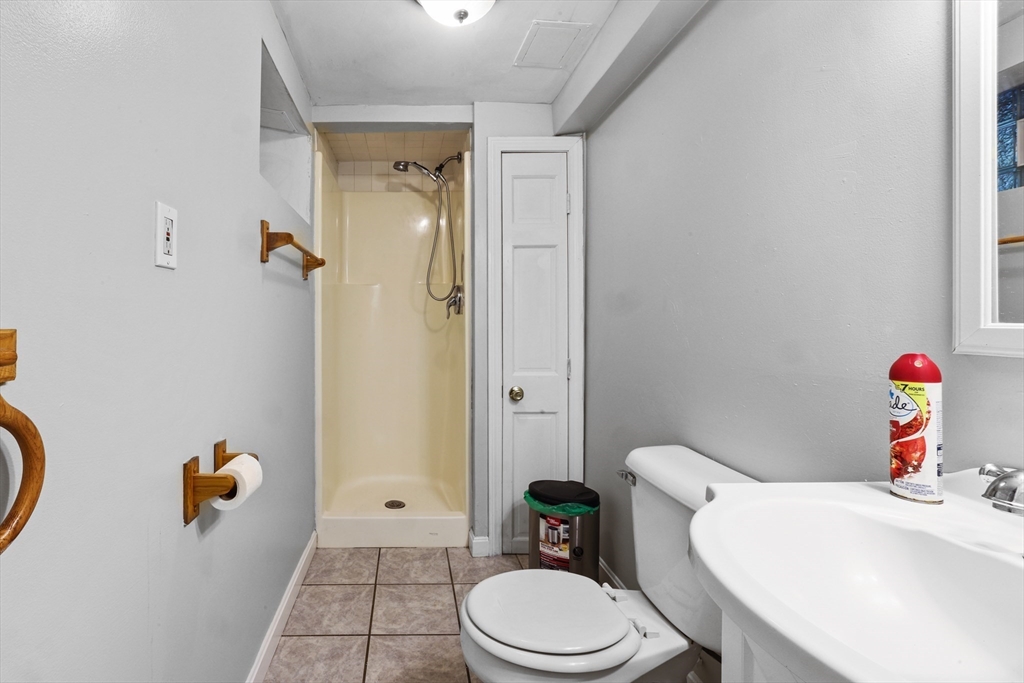 161 Foster Street Fall River, MA 02721 - Photo 19 of 20 a white toilet sitting next to a bathroom sink