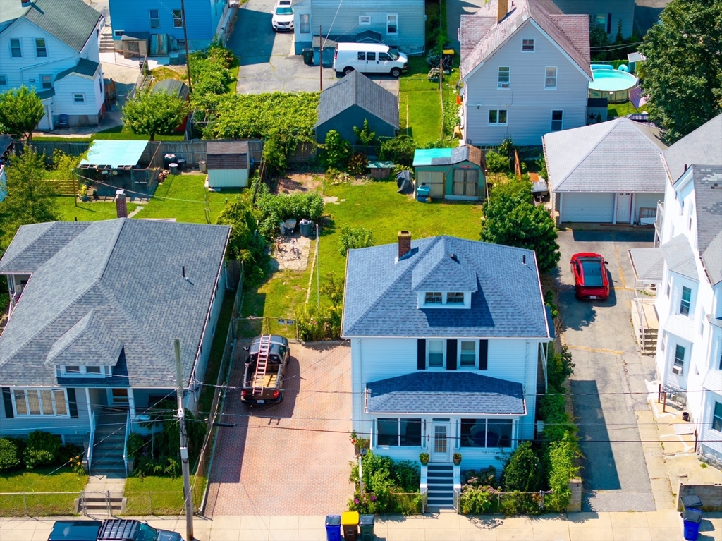 161 Foster Street Fall River, MA 02721 - Photo 2 of 20 an aerial view of multiple houses with a yard
