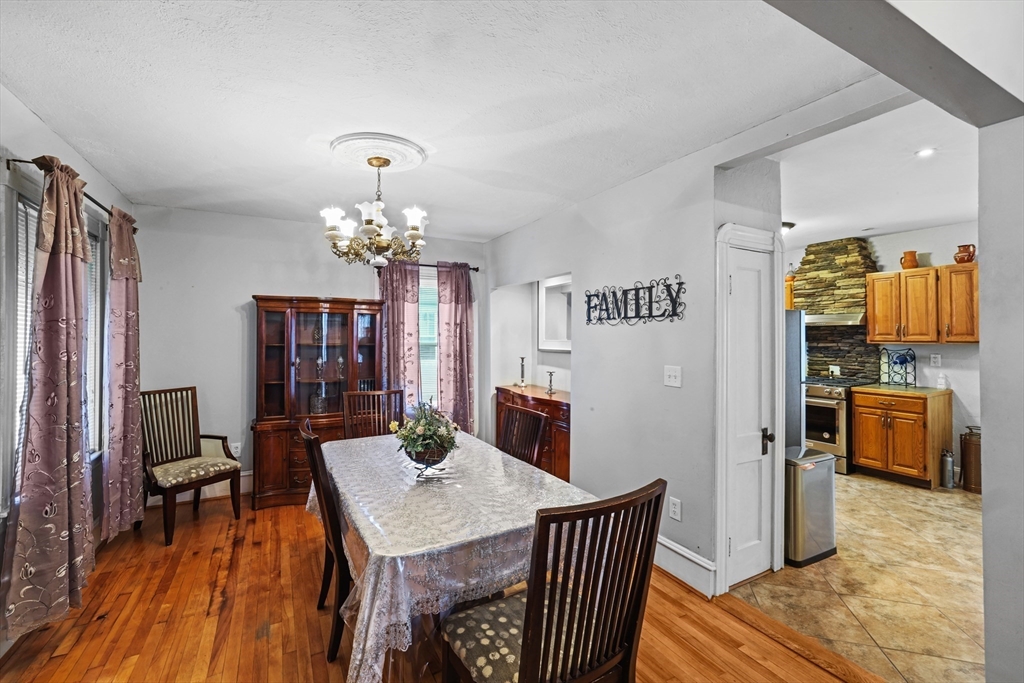 161 Foster Street Fall River, MA 02721 - Photo 7 of 20 a view of a dining room with furniture and chandelier
