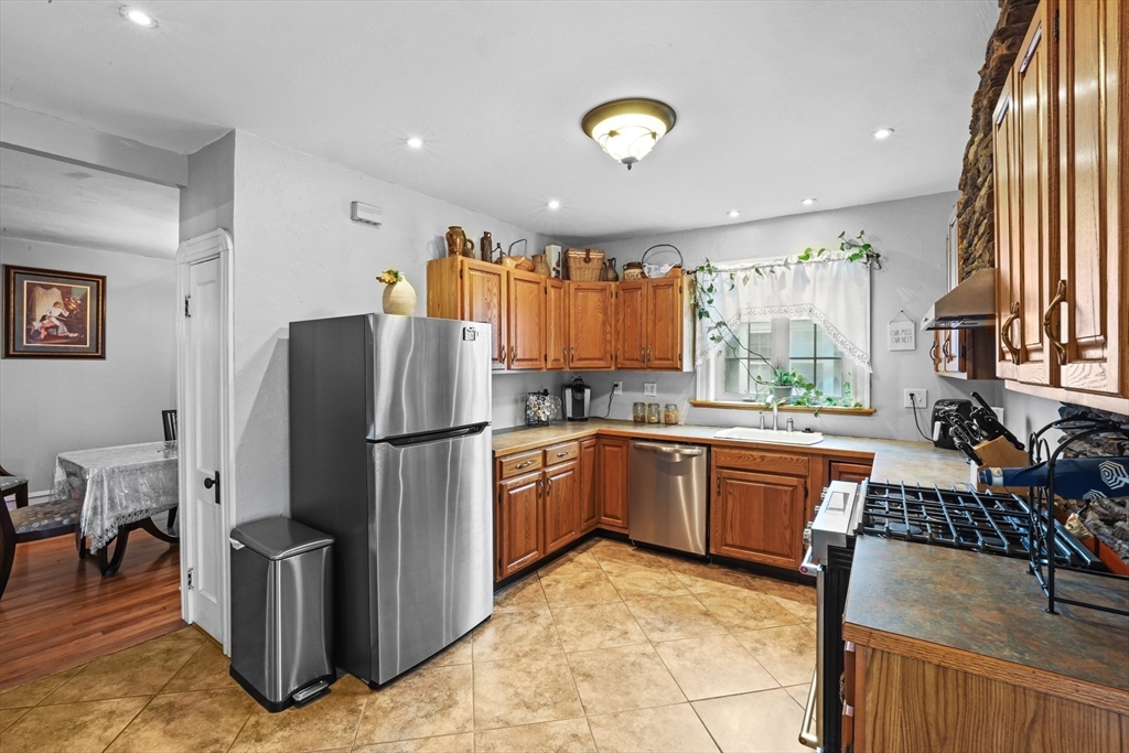 161 Foster Street Fall River, MA 02721 - Photo 9 of 20 a kitchen with refrigerator and window