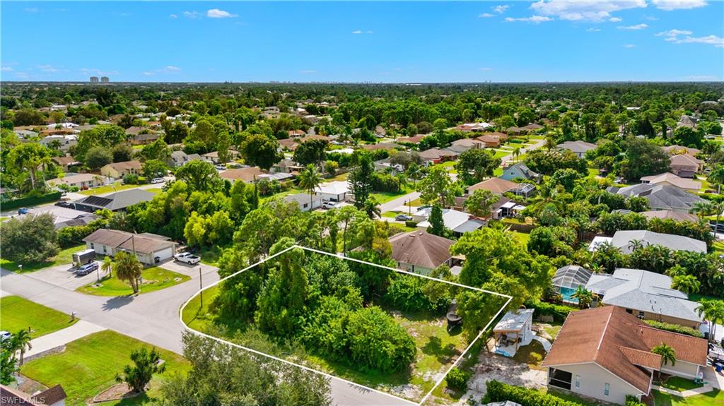 9167 Morris Road Fort Myers, FL 33967 - Photo 13 of 21 an aerial view of residential houses with outdoor space and trees