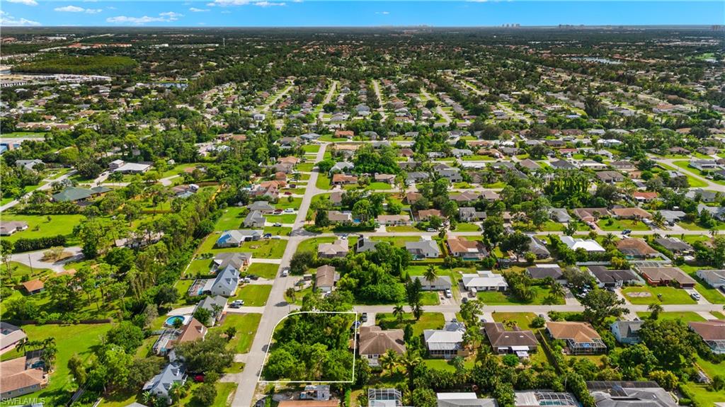 9167 Morris Road Fort Myers, FL 33967 - Photo 20 of 21 an aerial view of residential houses with outdoor space