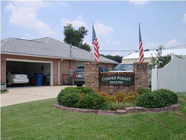 600 Copper Ridge Drive Cantonment, FL 32533 - Photo 20 of 22 Side entry garage. Entry sign to Copper Forest Estates.