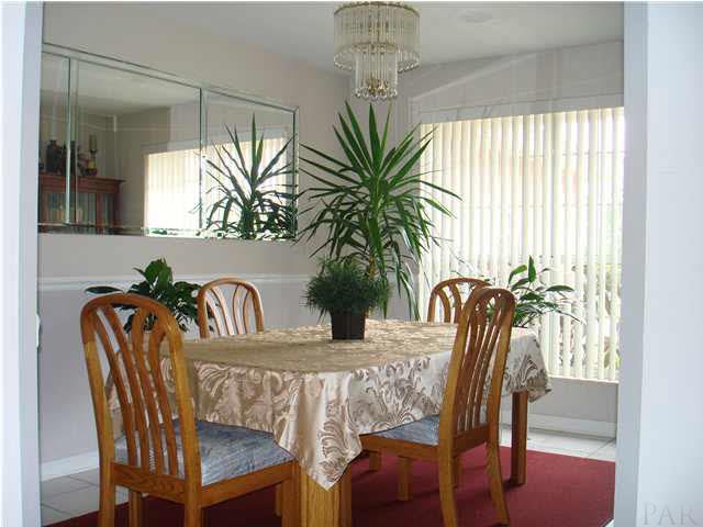 600 Copper Ridge Drive Cantonment, FL 32533 - Photo 6 of 22 Formal dining room with mirrored wall.