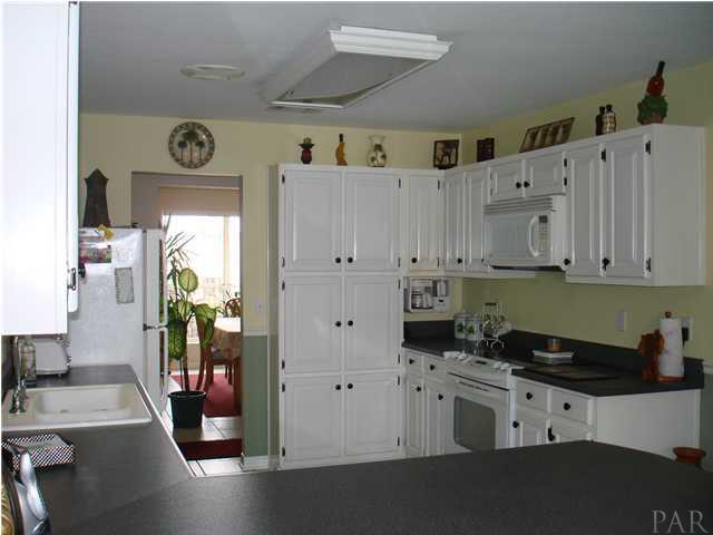 600 Copper Ridge Drive Cantonment, FL 32533 - Photo 7 of 22 Large kitchen with white cabinets, newer sink, faucet & dishwasher.