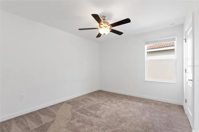 a bathroom with a granite countertop bathtub a sink and a mirror