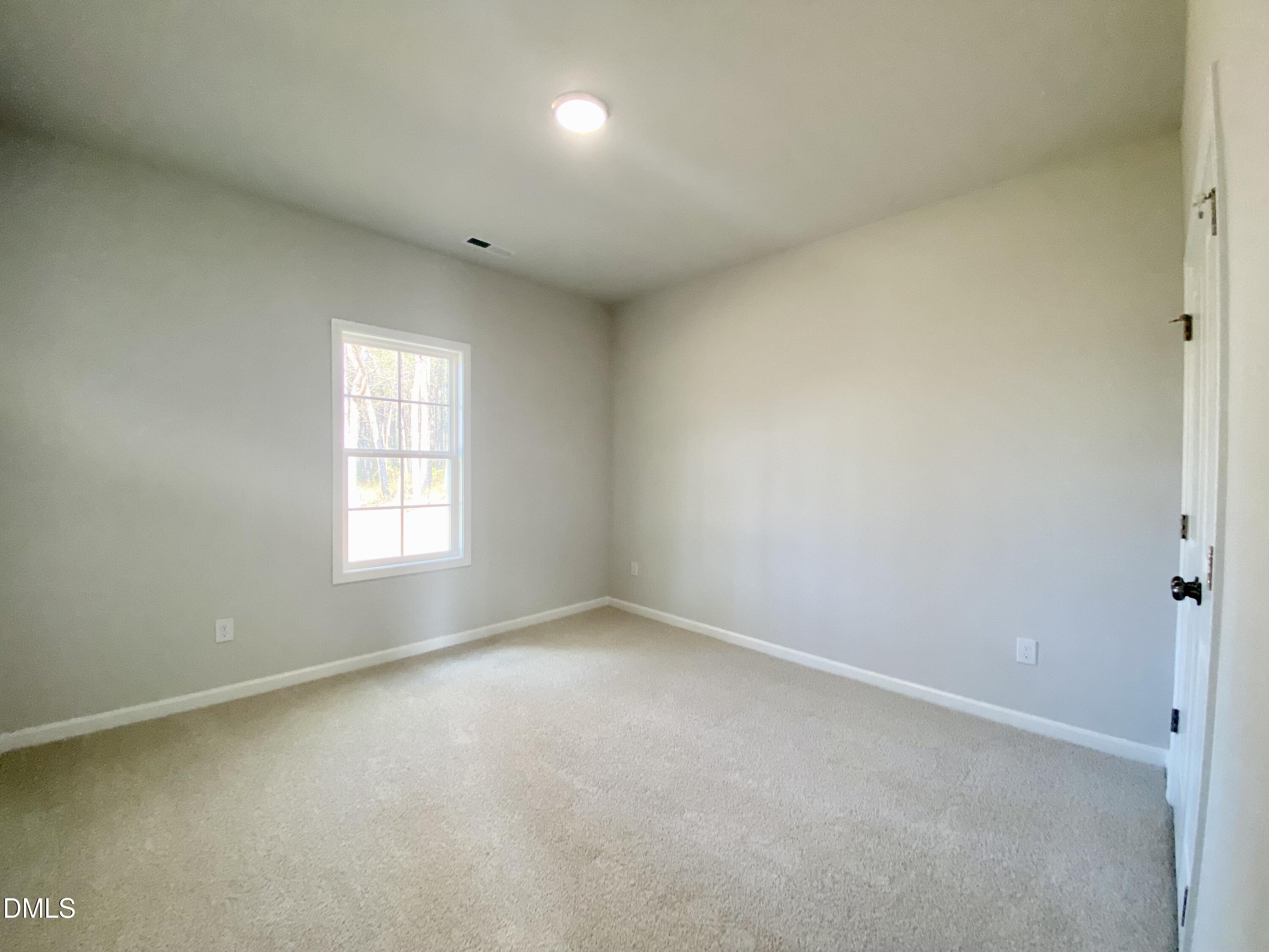 155 Nectar Lane Bunnlevel, NC 28323 - Photo 14 of 16 an empty room with a window
