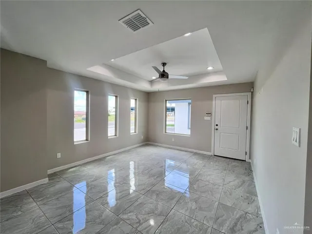 a view of an empty room with a window