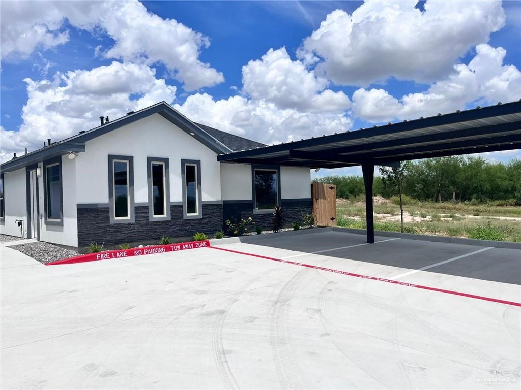 702 Palmer Road, Unit 1 Mission, TX 78573 - Photo 2 of 13 a view of a house with backyard and porch