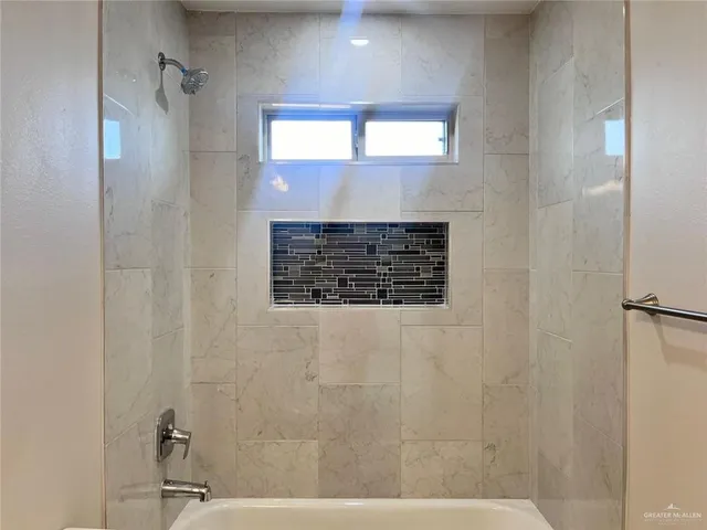 a bathroom with a sink and a shower