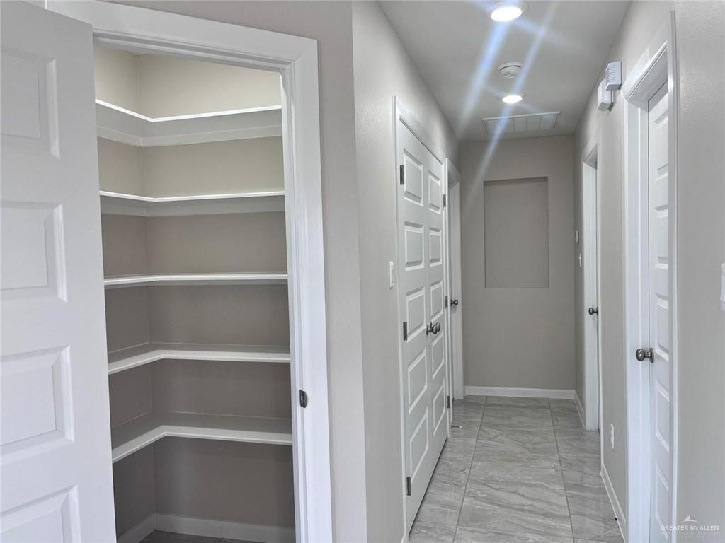 702 Palmer Road, Unit 1 Mission, TX 78573 - Photo 10 of 13 a view of a hallway