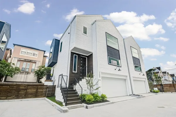 a front view of a house with a garage