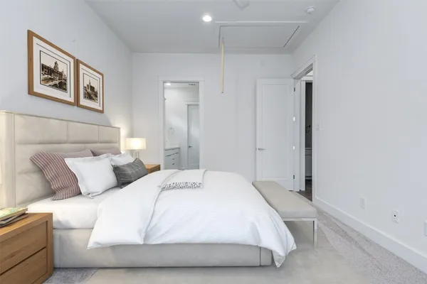 a bedroom with a bed and wall painting