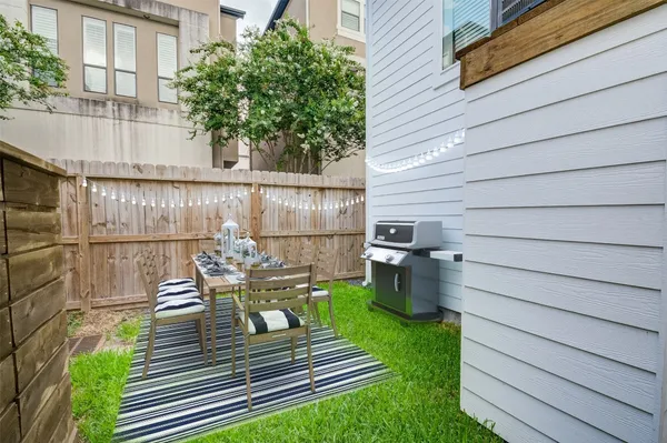 a view of a deck with chairs and a fire pit