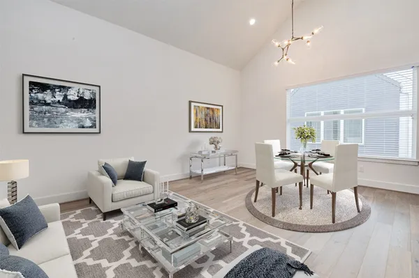 a living room with furniture and a table