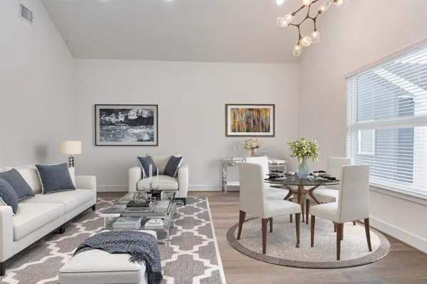 a living room with furniture or couch and a potted plant
