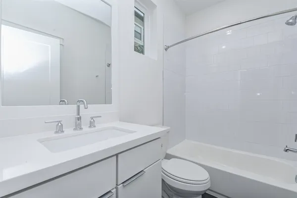 a bathroom with a sink a toilet and a bathtub