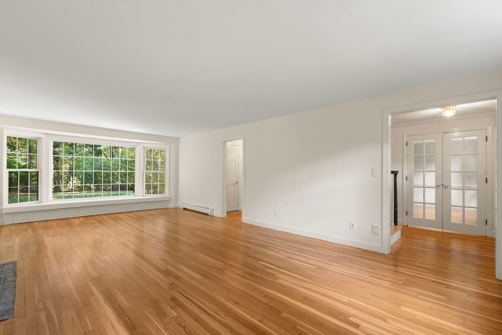13 Wood Road Sherborn, MA 01770 - Photo 16 of 38 wooden floor in an empty room with a window