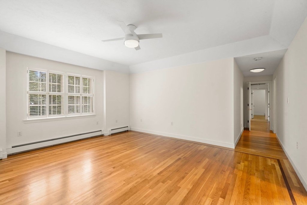 13 Wood Road Sherborn, MA 01770 - Photo 22 of 38 a view of an empty room with wooden floor and a window
