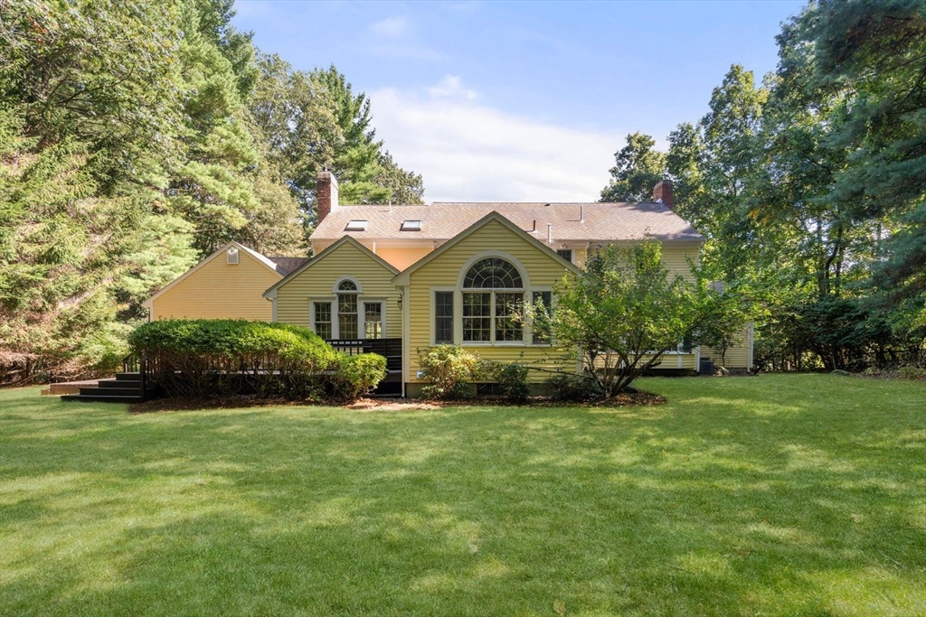 13 Wood Road Sherborn, MA 01770 - Photo 3 of 38 a view of a house with a big yard and potted plants