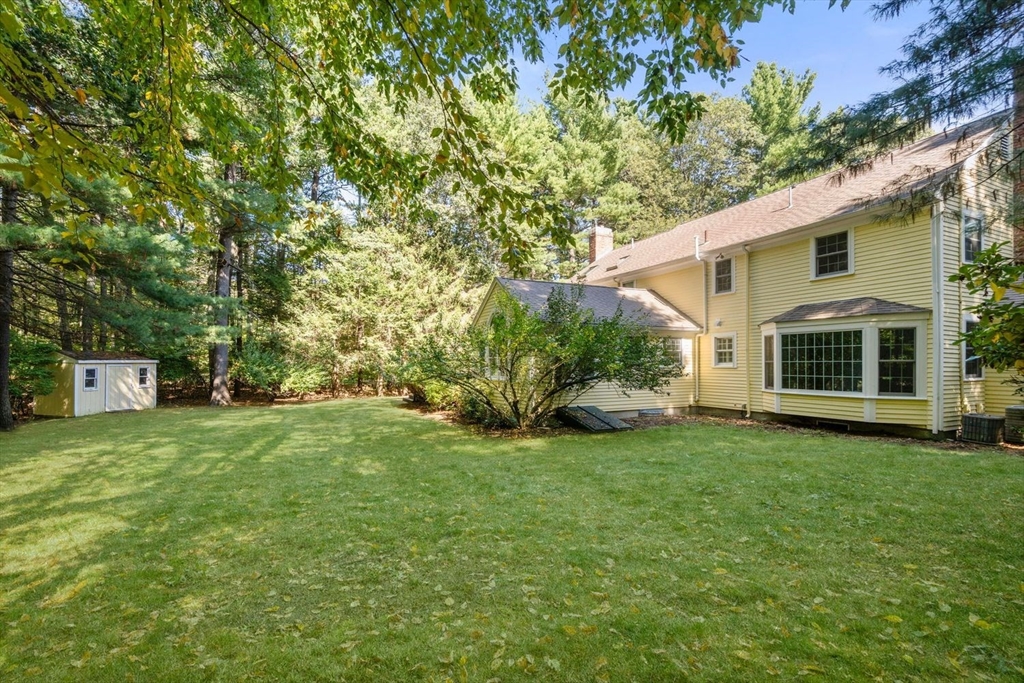 13 Wood Road Sherborn, MA 01770 - Photo 35 of 38 a front view of a house with a garden