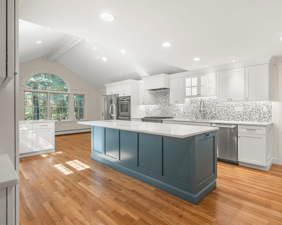 13 Wood Road Sherborn, MA 01770 - Photo 6 of 38 a kitchen with stainless steel appliances granite countertop a stove a sink and a refrigerator