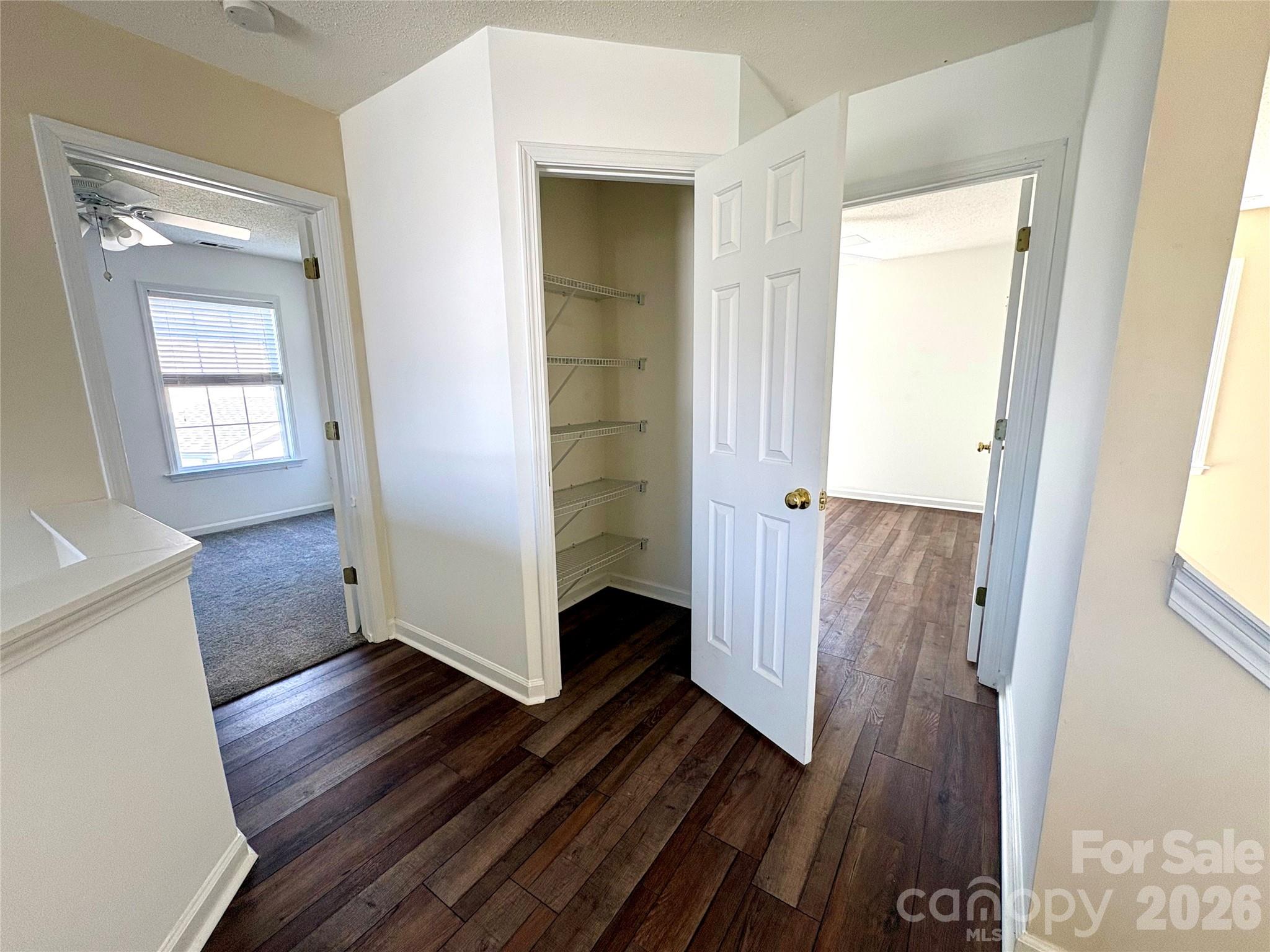 89 Woodfern Road Fletcher, NC 28732 - Photo 11 of 19 a view of a hallway with wooden floor and a living room