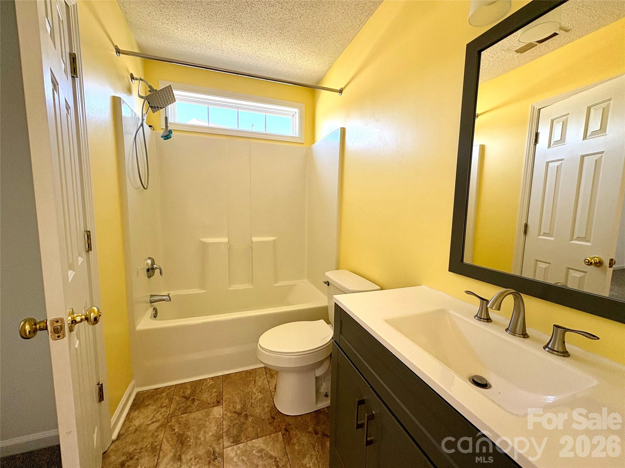 89 Woodfern Road Fletcher, NC 28732 - Photo 13 of 19 a bathroom with a sink a toilet and shower