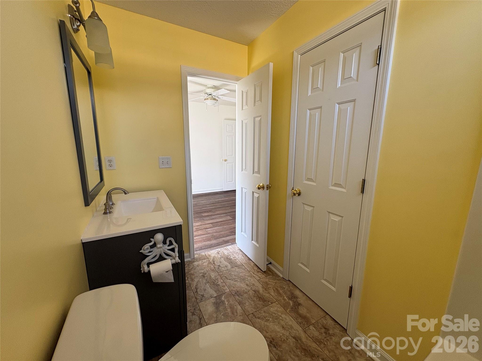 89 Woodfern Road Fletcher, NC 28732 - Photo 14 of 19 a bathroom with a sink a toilet and shower