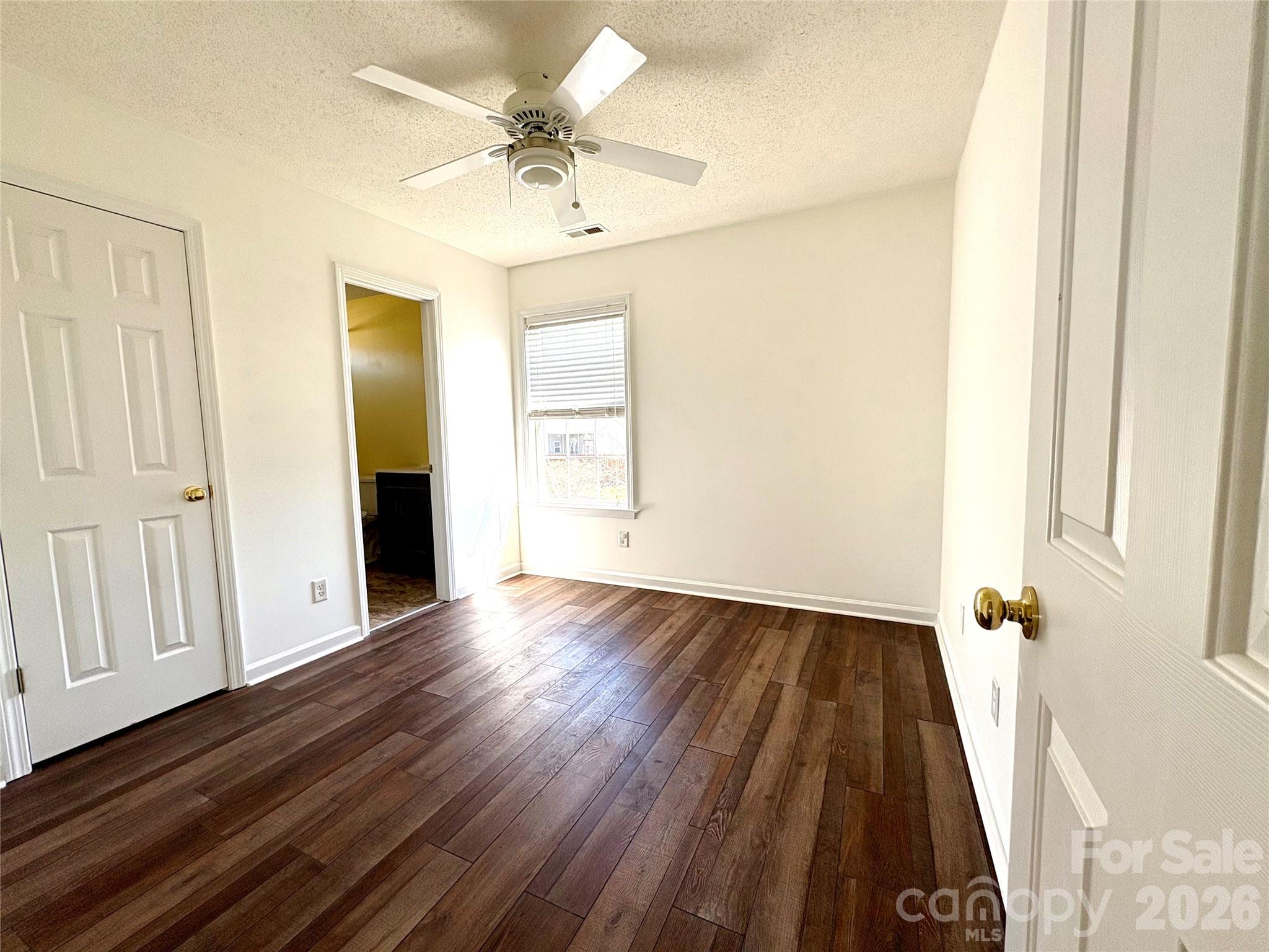 89 Woodfern Road Fletcher, NC 28732 - Photo 15 of 19 wooden floor in an empty room with a window