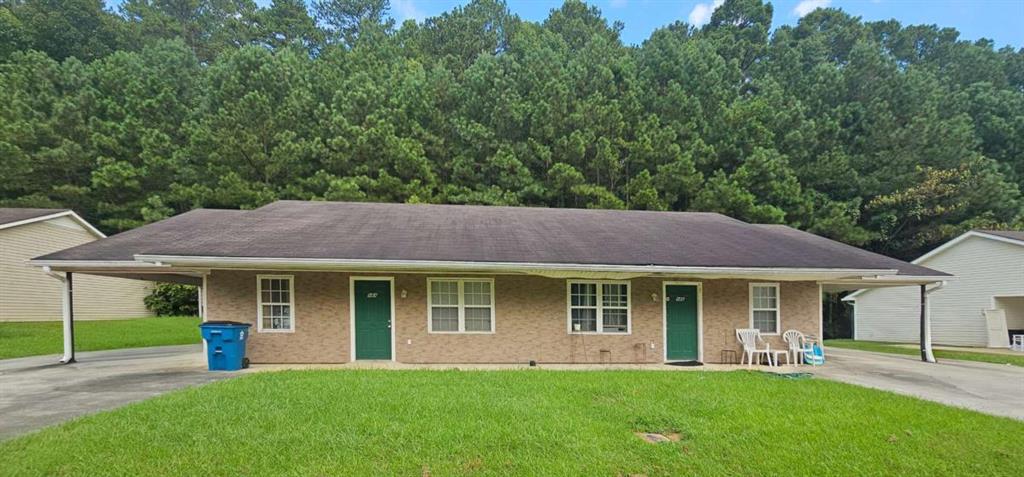 94 A&b Dodd Boulevard Rome, GA 30161 - Photo 1 of 1 a front view of a house with a garden and porch