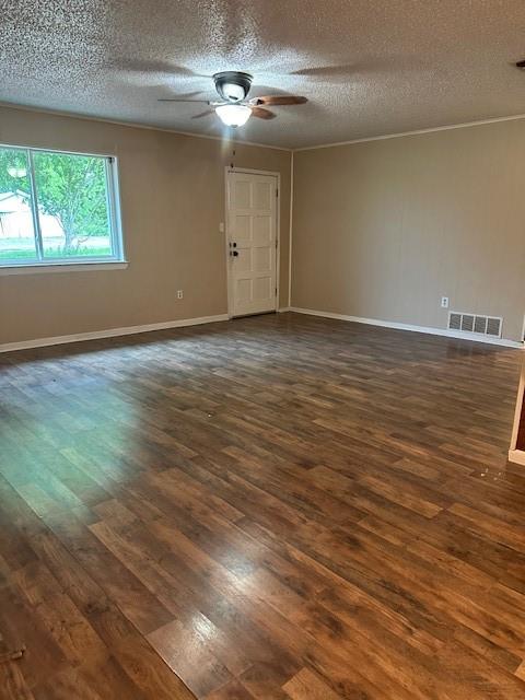 209 School Street Blue Ridge, TX 75424 - Photo 3 of 9 an empty room with wooden floor chandelier fan and windows