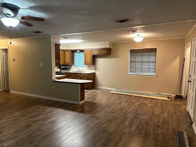 a view of kitchen with wooden floor and window