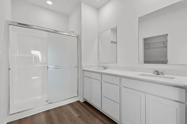 a bathroom with 2 sink and a mirror