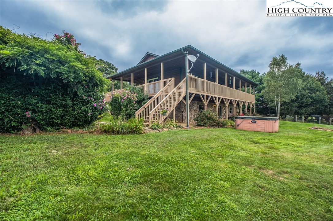 1453 Big Flatts Church Road Fleetwood, NC 28626 - Photo 4 of 50 a view of a house with a big yard
