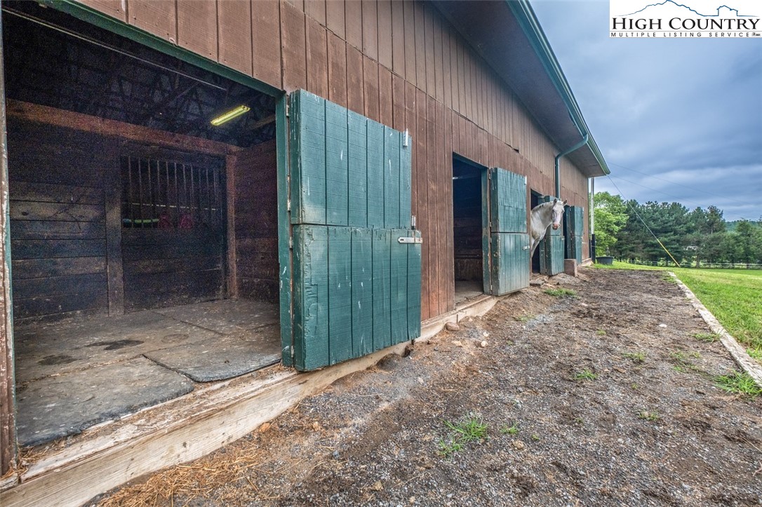 1453 Big Flatts Church Road Fleetwood, NC 28626 - Photo 45 of 50 a view of a house with a backyard