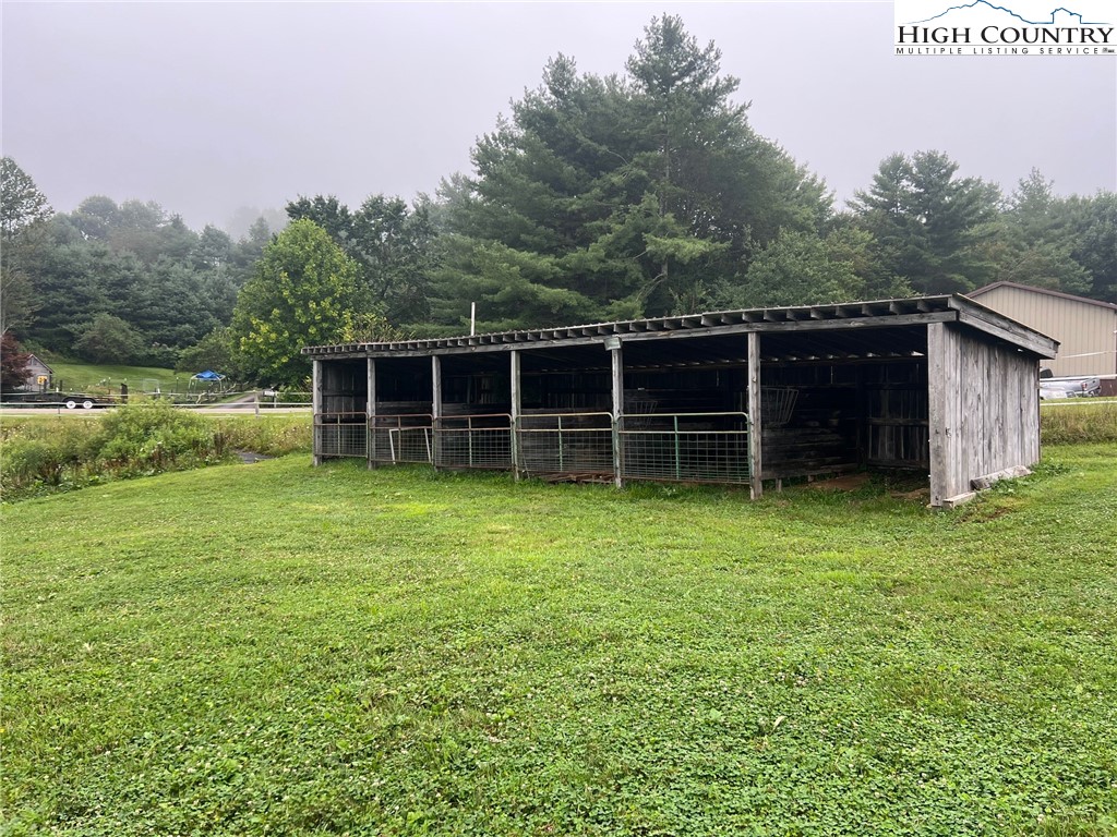 1453 Big Flatts Church Road Fleetwood, NC 28626 - Photo 49 of 50 a view of a house with a garden