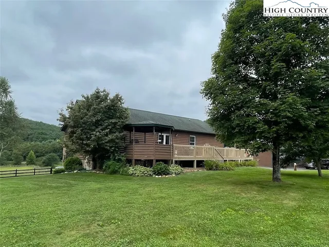 a view of a garden with a bench in the garden