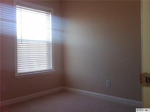 1355 North Dobys Bridge Road Fort Mill, SC 29715 - Photo 6 of 12 an empty room with a window